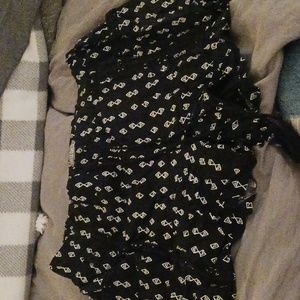 Lined black and white dress shorts with black lace embellishment on pockets and